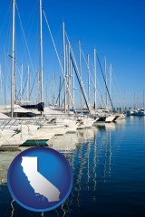 california map icon and sailboats in a marina