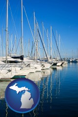michigan map icon and sailboats in a marina