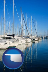 oklahoma map icon and sailboats in a marina