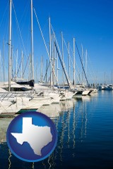 texas map icon and sailboats in a marina