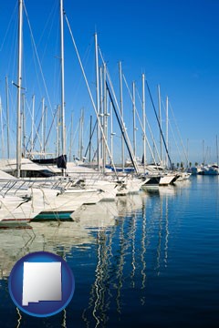 sailboats in a marina - with New Mexico icon